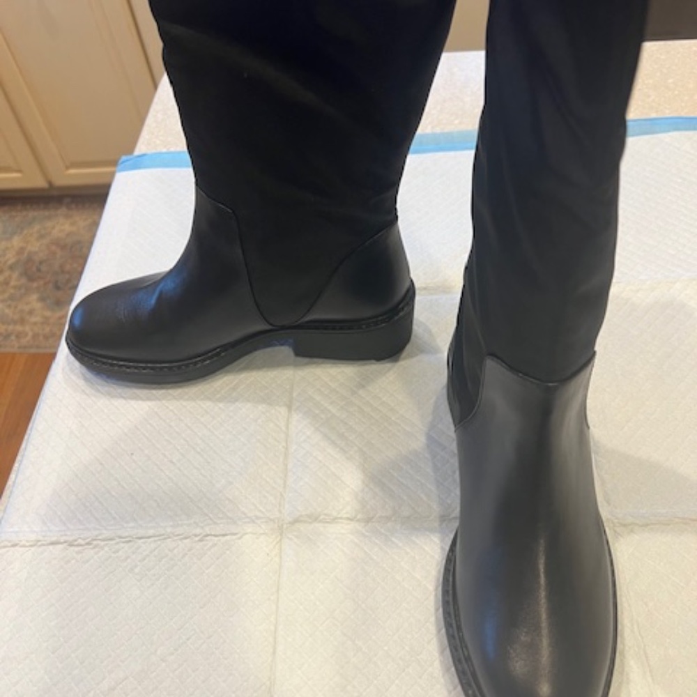 Calvin Klein women's black leather & synthetic boots.  New in box, never worn.
